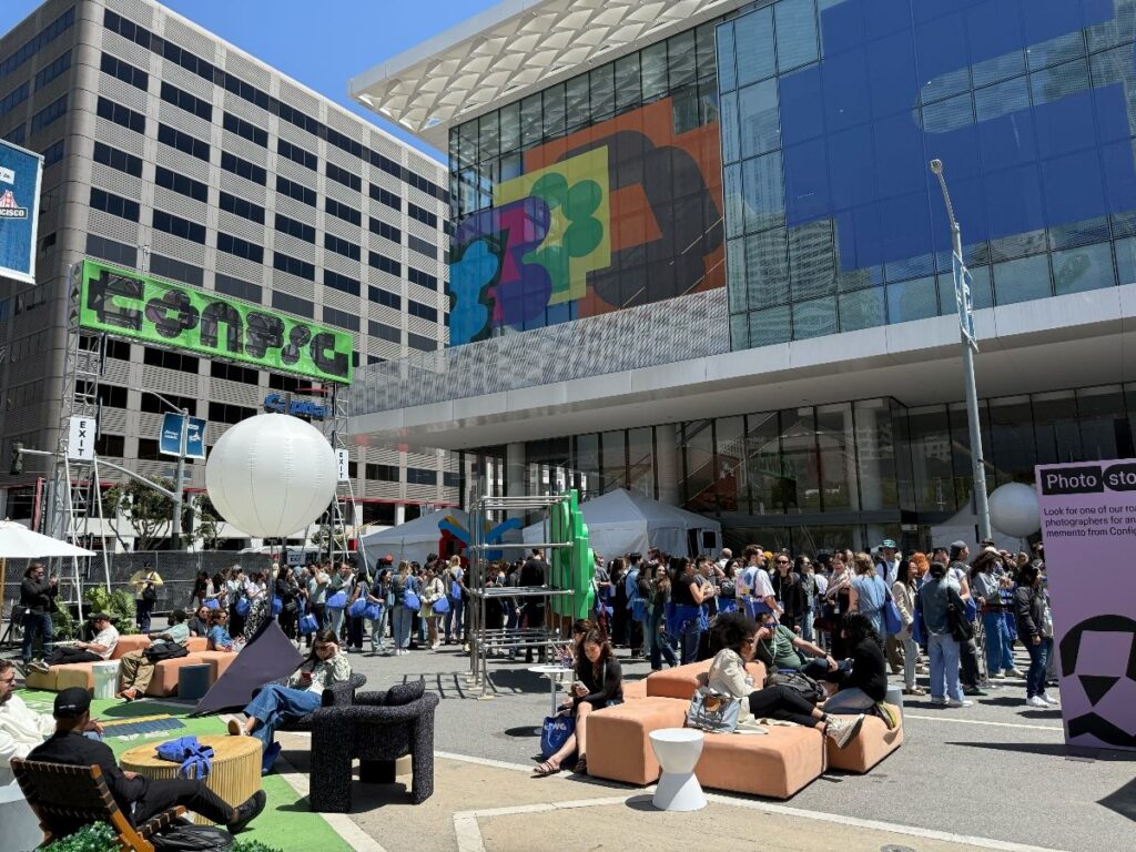 Scenes from outside the Figma Config conference in San Francisco the week of May 5, 2025. People are milling about with a big Config sign on a building.